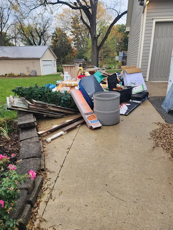 Dumpster being loaded with debris for Commercial Dumpster Rental in Statesville